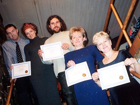 Graduates with their certificates